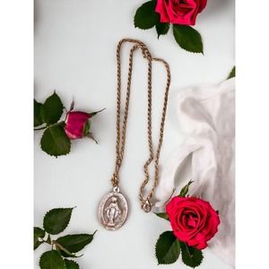 Silver mother Mary medallion with long gold chain